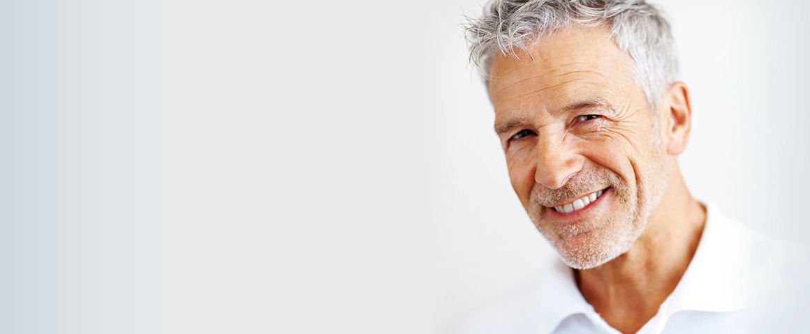 grey haired man smiling after consulting
